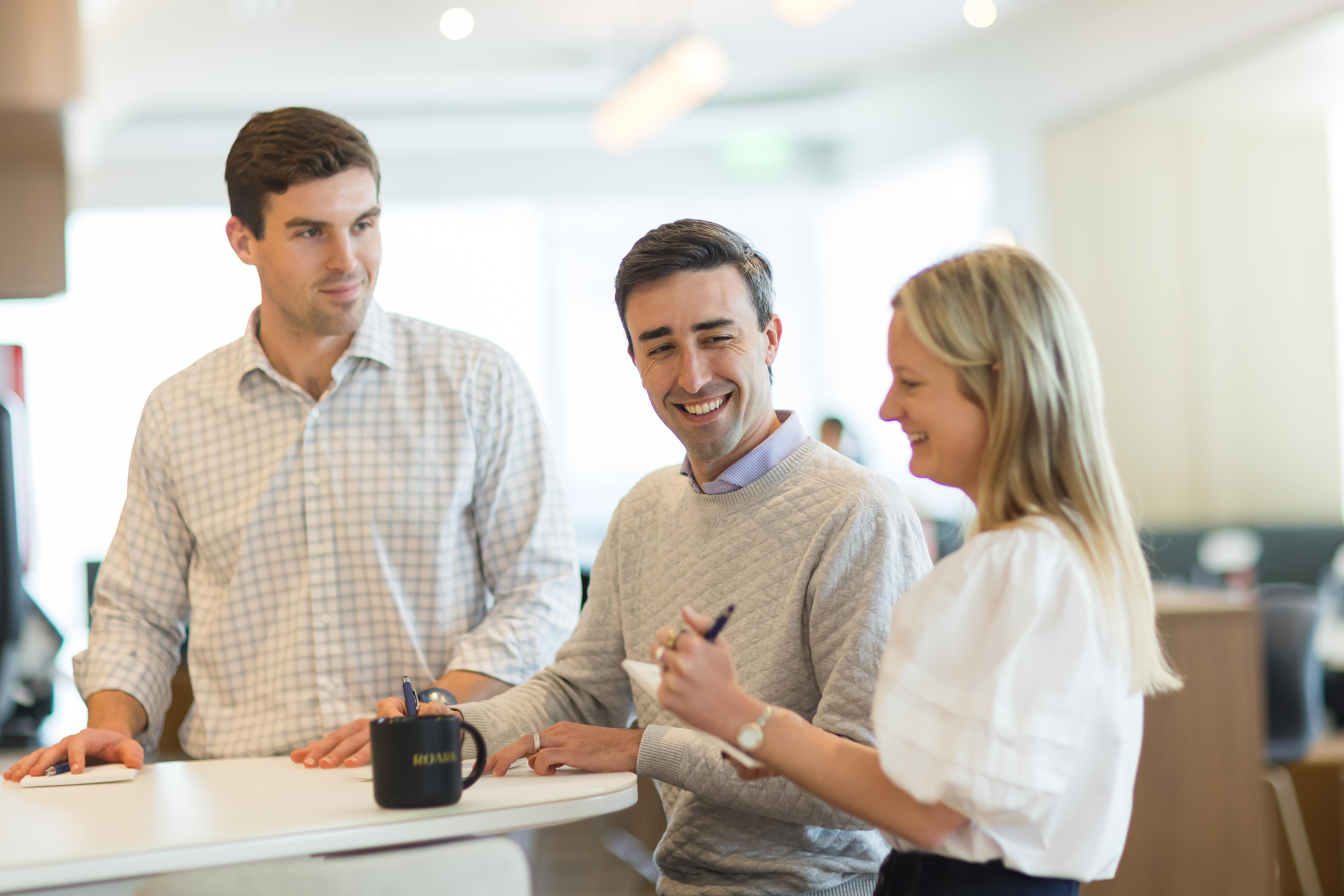 2 Men and 1 Woman in conversation